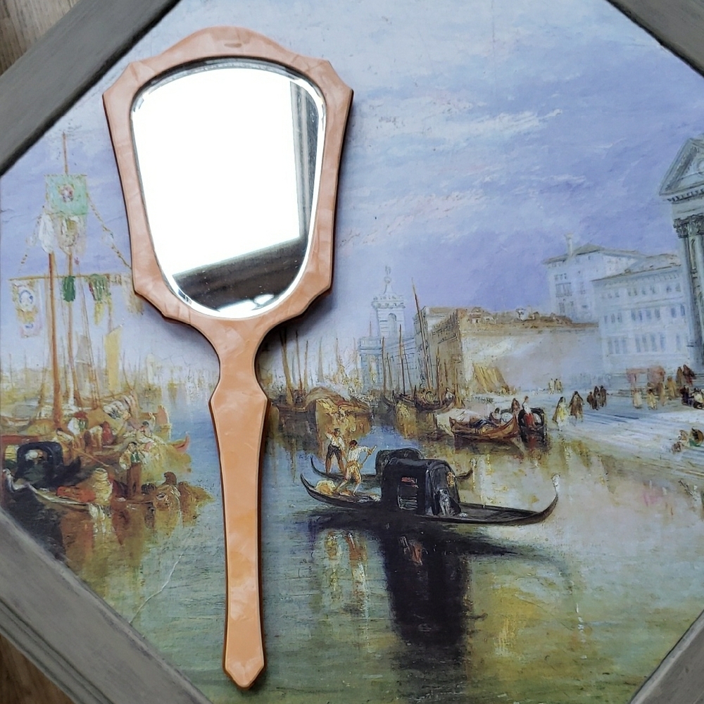 Antique Celluloid Handheld Mirror in a Peach color.